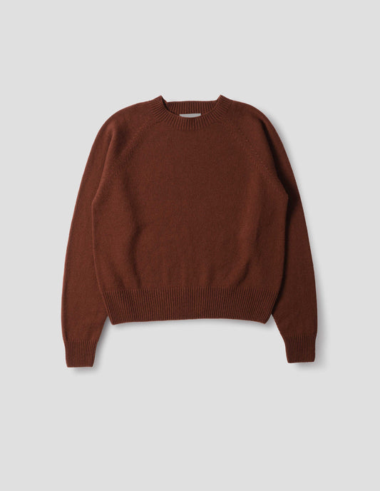 Brown fully fashioned seamless merino cashmere jumper with crew neck, raglan sleeve,  and with ribbed neck, cuffs and hem. Front flat lay view.