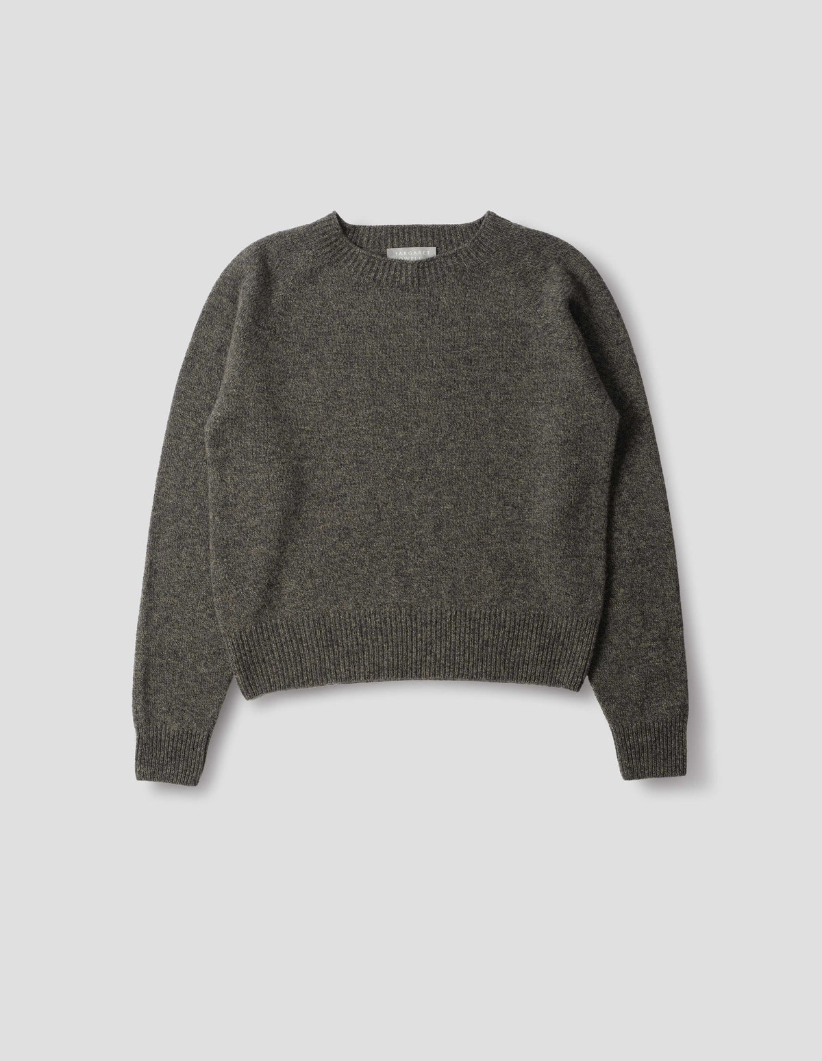 Brownish grey fully fashioned seamless merino cashmere jumper with crew neck, raglan sleeve, and with ribbed neck, cuffs and hem. Front flat lay view.
