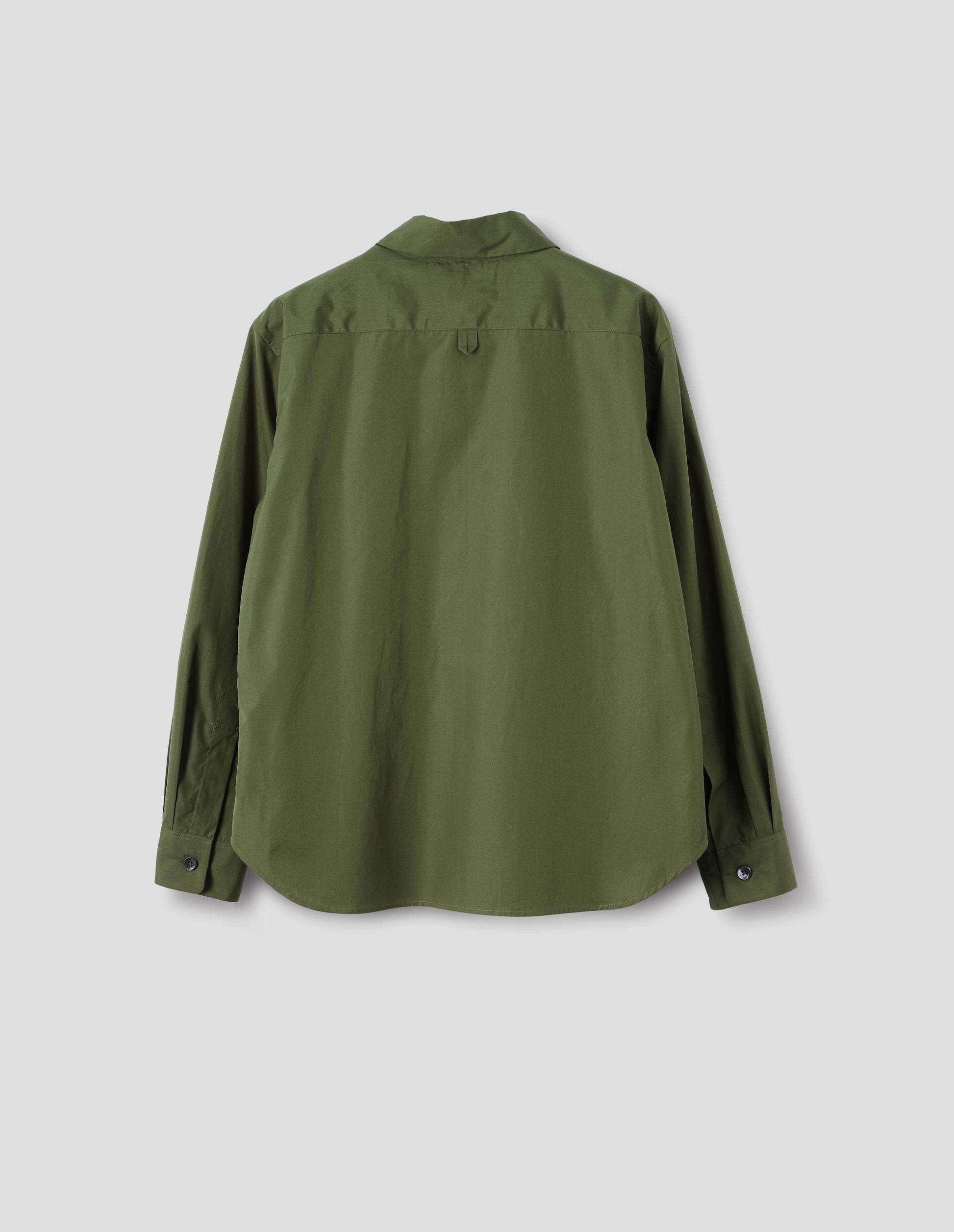 Green cotton shirt with hanger loop detail on back yoke, mother of pearl buttons on cuffs and curved hem. Back flat lay view.