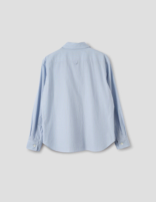 Light blue cotton shirt with grey and beige stripes, hanger loop detail on back yoke, mother of pearl buttons on cuffs and curved hem. Back flat lay view.