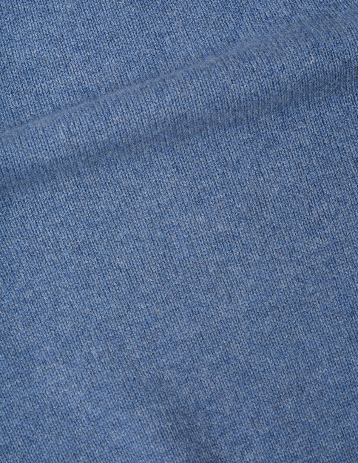 Light blue merino cashmere jumper fabric swatch.