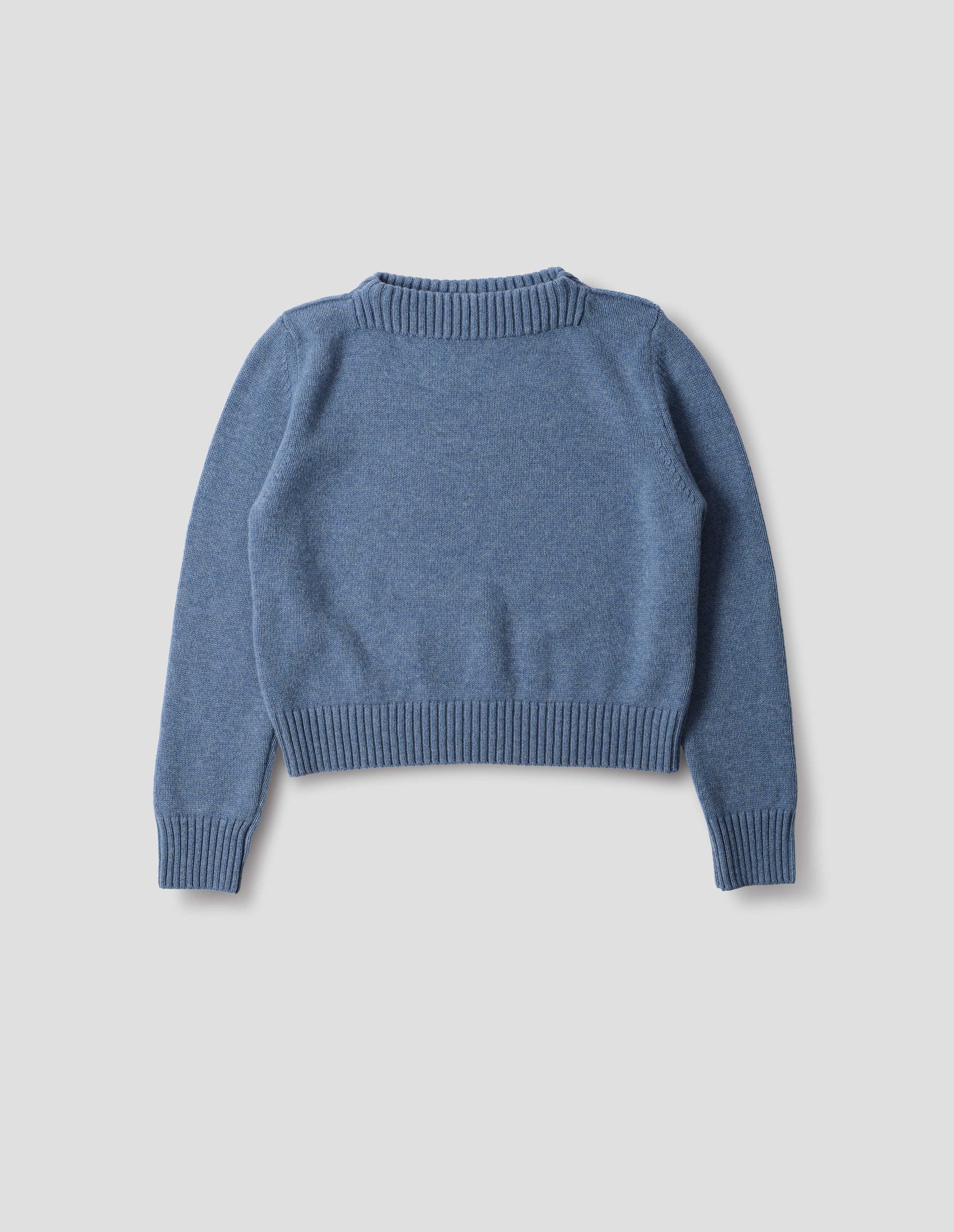 Light blue merino cashmere fully fashioned jumper with higher square neckline and with wide rib detailing on neck, cuffs and hem. Front flat lay view.