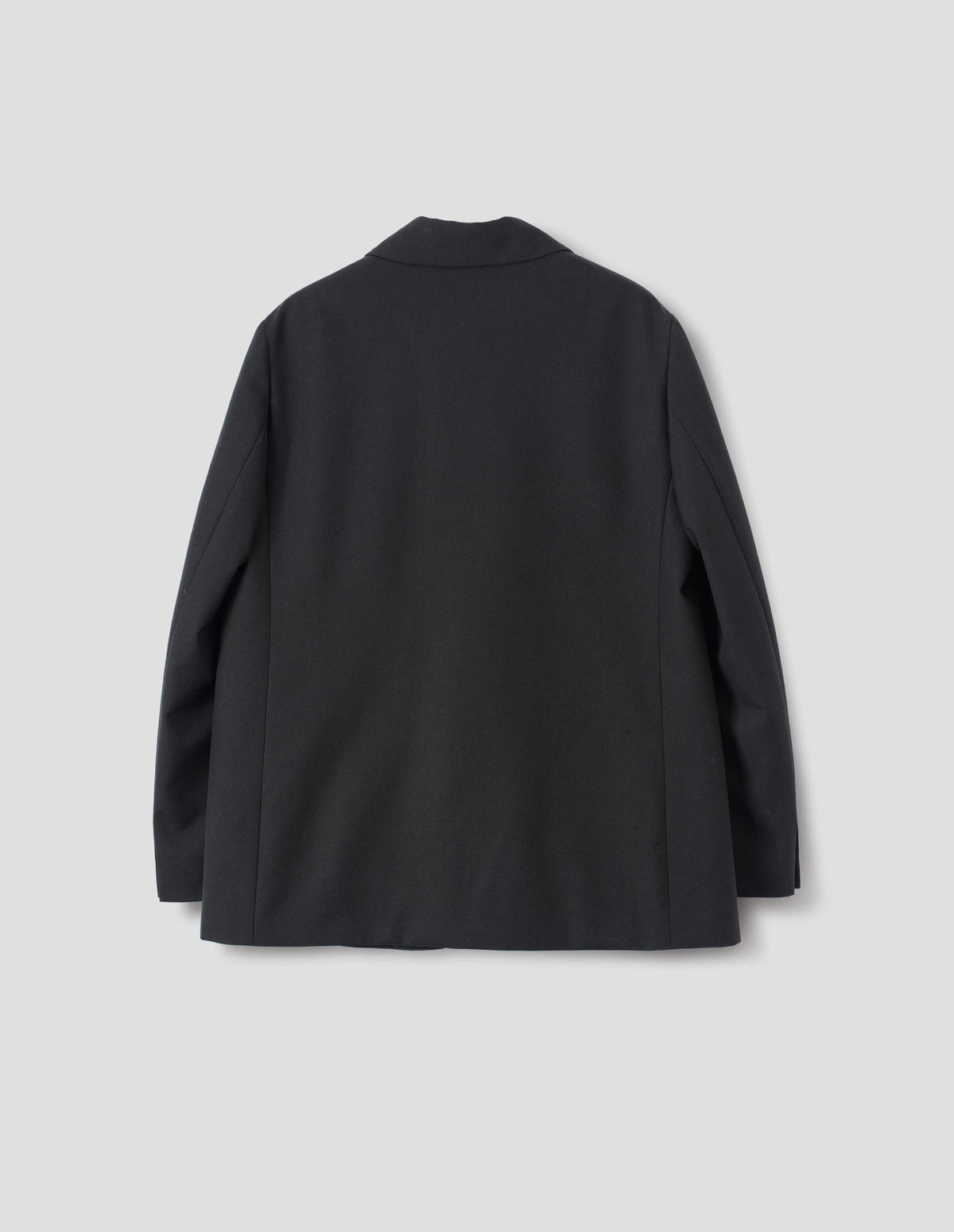 Black wool blazer with horn buttons on cuffs. Back flat lay view.