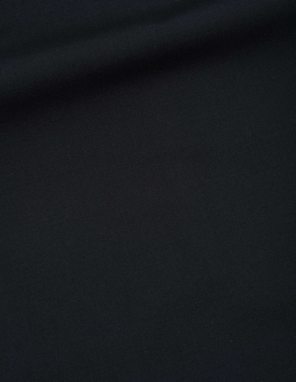 Black dry wool plainweave trousers fabric swatch.