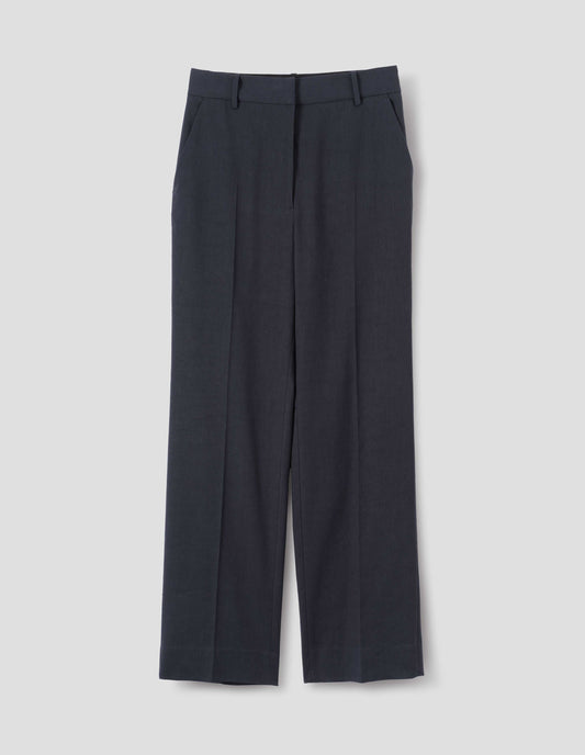 Dark blue cotton linen trousers with belt loops and slant pockets. Front flat lay view.