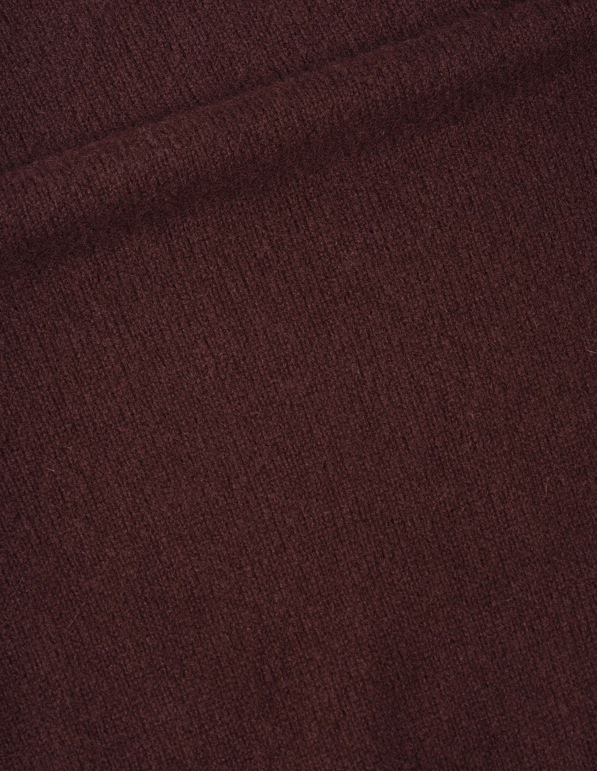 Dark red cashmere jumper fabric swatch.