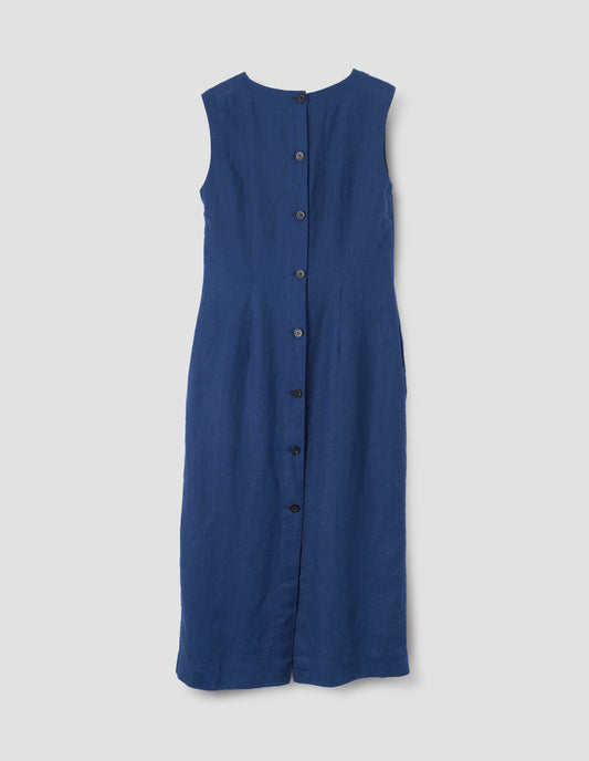 Blue straight cut midi length sleeveless dress with horn buttons and back vent, back flat lay view.