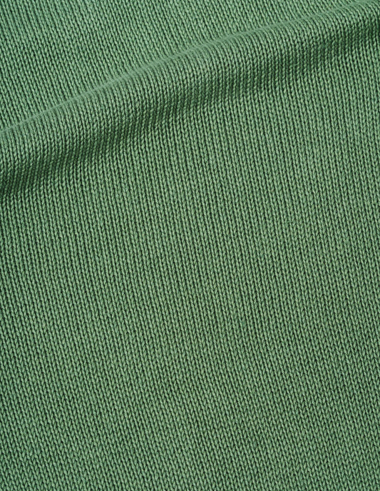 Green jumper linen cotton fabric swatch.