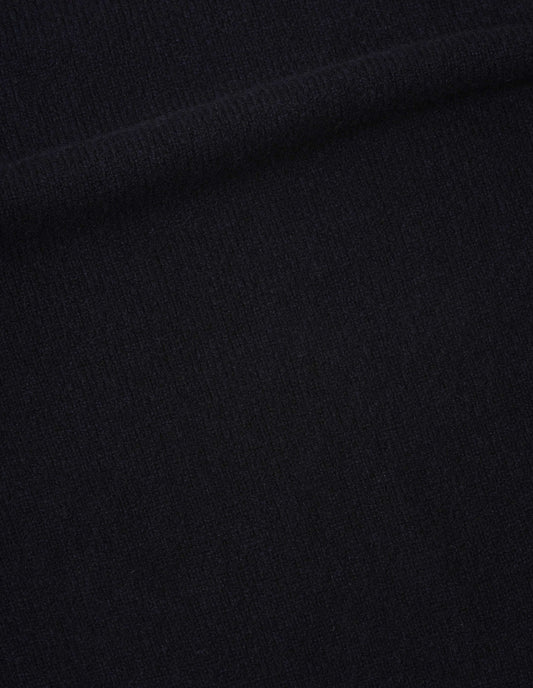 Dark blue jumper soft spun wool fabric swatch.