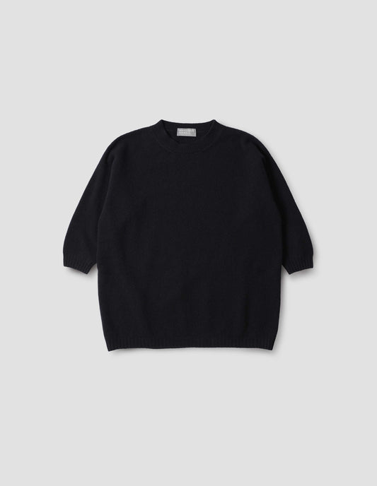 Dark blue crew neck jumper with cropped sleeves, front flat lay view.