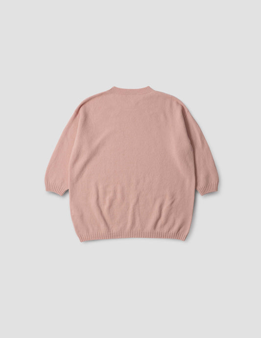 Pink crew neck jumper with cropped sleeves, back flat lay view.