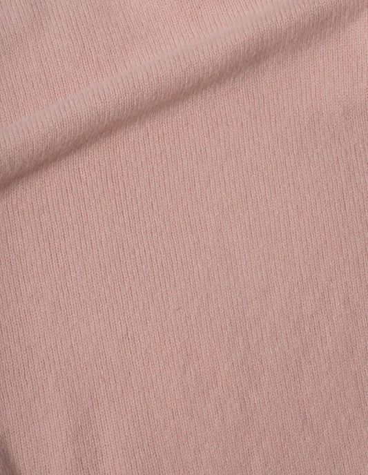 Pink jumper soft spun wool fabric swatch.