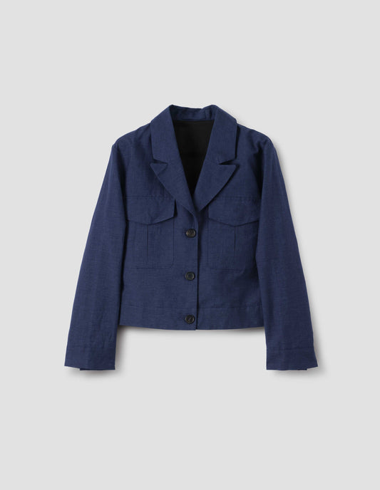 Navy blue cropped utility jacket with flap front pockets and horn buttons, front flay lay view.