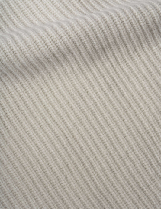 Beige knitted waistcoat soft spun wool fabric swatch.