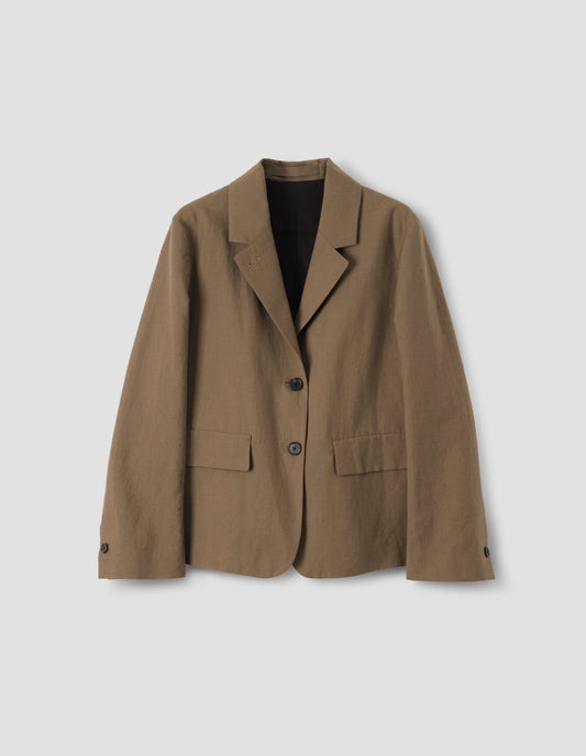 Brown blazer with two horn button closure, horn button cuff sleeves and front flap pockets, front flat lay view.