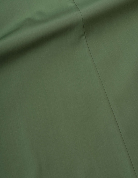 Green flared skirt soft compact cotton fabric swatch.