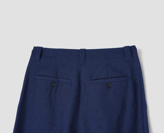 Blue culottes with two button-through welt back pockets and three belt loops, back flat lay view.