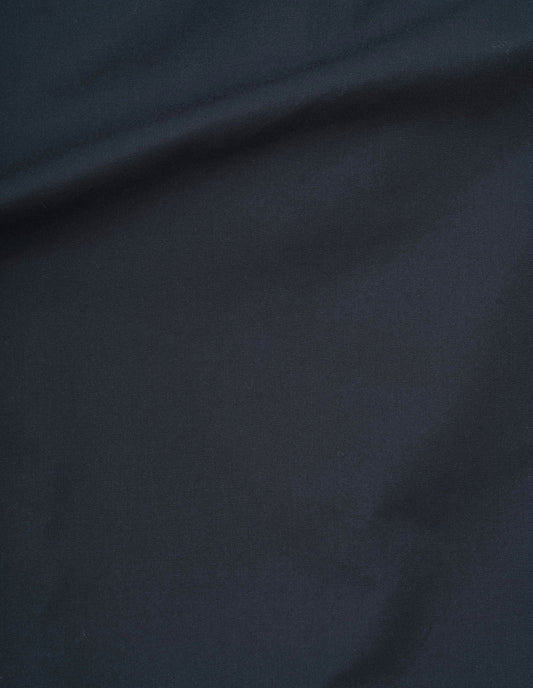 Navy blue proofed worn cotton twill fabric swatch. 