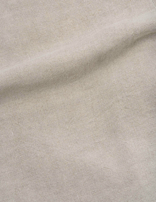 Beige stone washed linen fabric swatch.