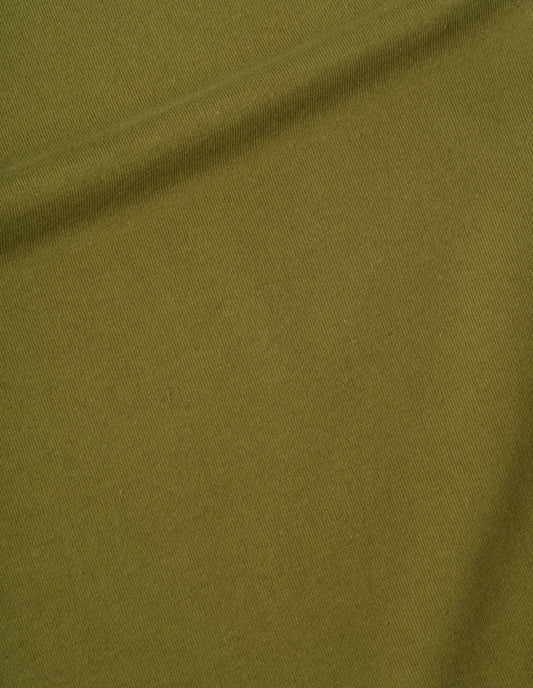 Green sleeveless top dry handle jersey fabric swatch.