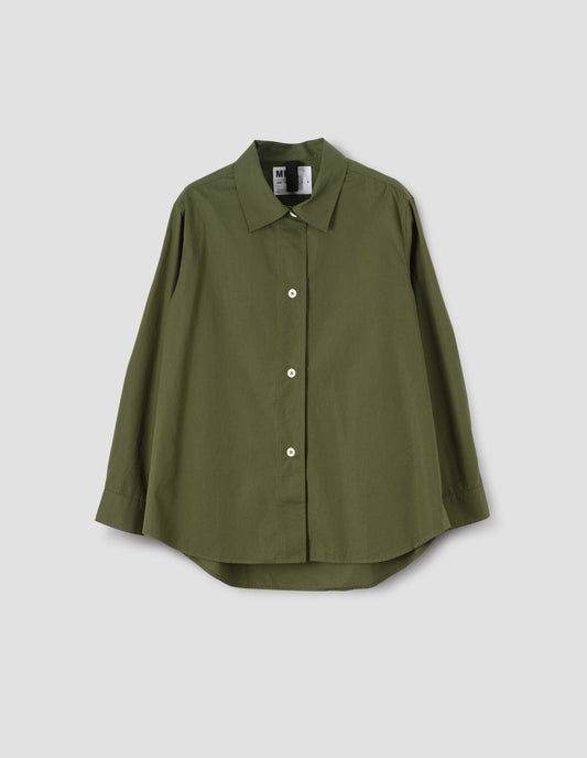 Green longline, long sleeve shirt with corozo button closure and elongated hem, front flat lay view.