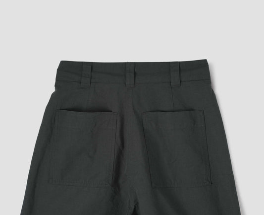 Dark grey trousers with two back pockets and three belt loops, back flat lay view.