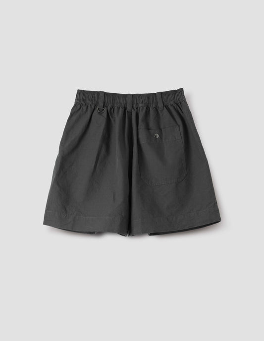 Dark grey shorts with elasticated waist, three belt loops with one D-ring detail and press stud fastening on back pocket, back flat lay view. 