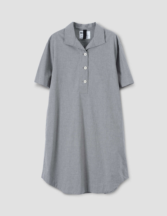 Grey shirt dress with short sleeves and white corozo brace button fastening, front flat lay view.