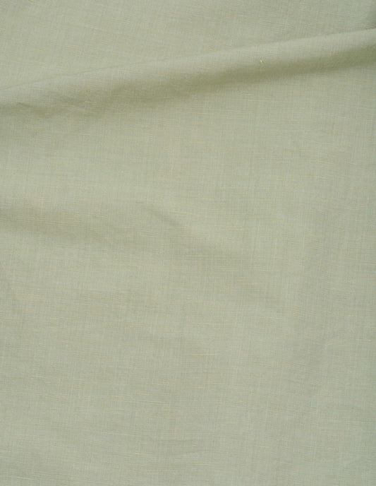 Light green long sleeve shirt, lightweight cotton linen fabric swatch.
