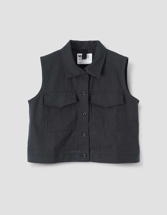 Navy blue sleeveless shirt with corozo button closure and two flap chest pockets, front flat lay view. 