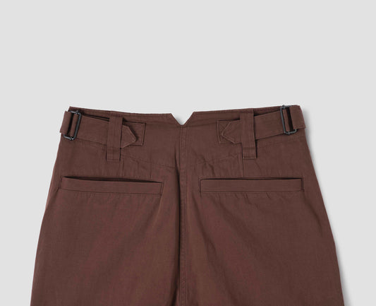 Brown trousers with side adjusters and welt back pockets, back flat lay view.