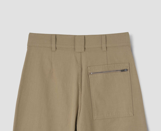 Beige trousers with three belt loops and zip patch back pocket, back flat lay view.