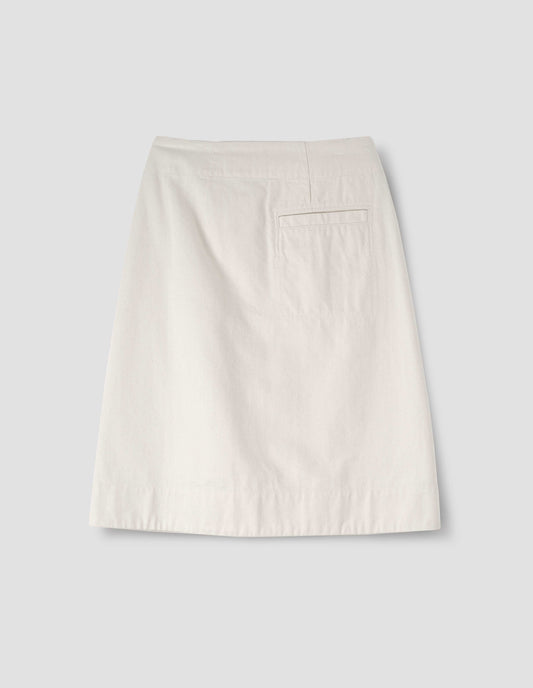 White skirt with welt back pocket, back flat lay view.