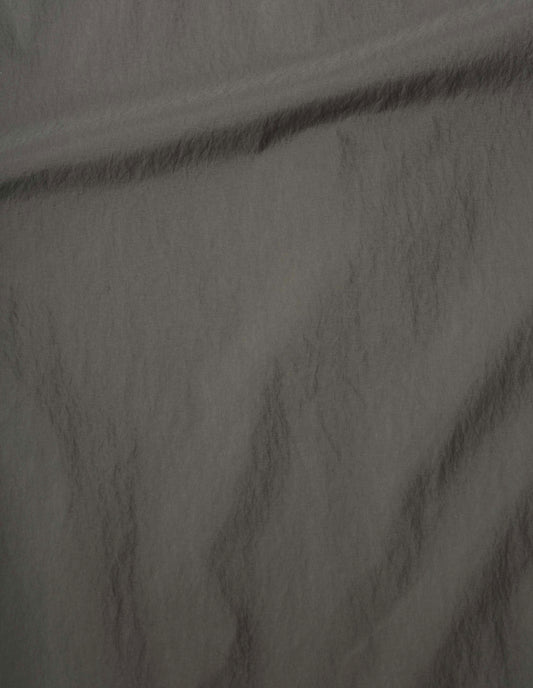 Dark green trousers lightweight nylon taslan fabric swatch.