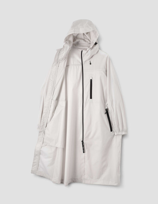 Light grey boxy hooded coat with elasticated toggle adjusters, zip fastening, zip side and chest pockets with elasticated cuffs, front open flat lay view.