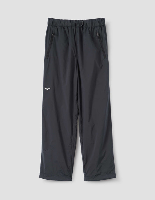 Dark blue trousers with zip side pockets with elasticated pulls, elasticated waist with toggle adjuster and small white Mizuno logo, front flat lay view.