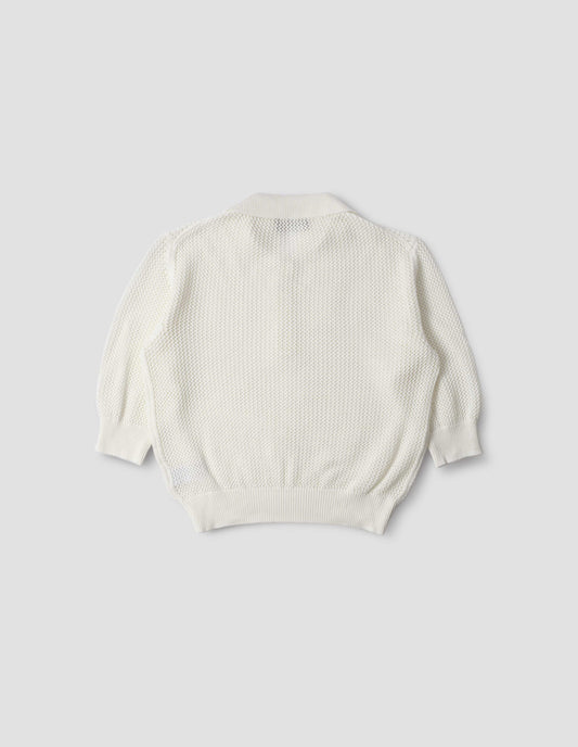 Beige pointelle polo shirt with cropped sleeves, back flat lay view.