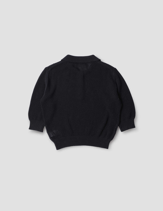 Dark blue pointelle polo shirt with cropped sleeves, back flat lay view.