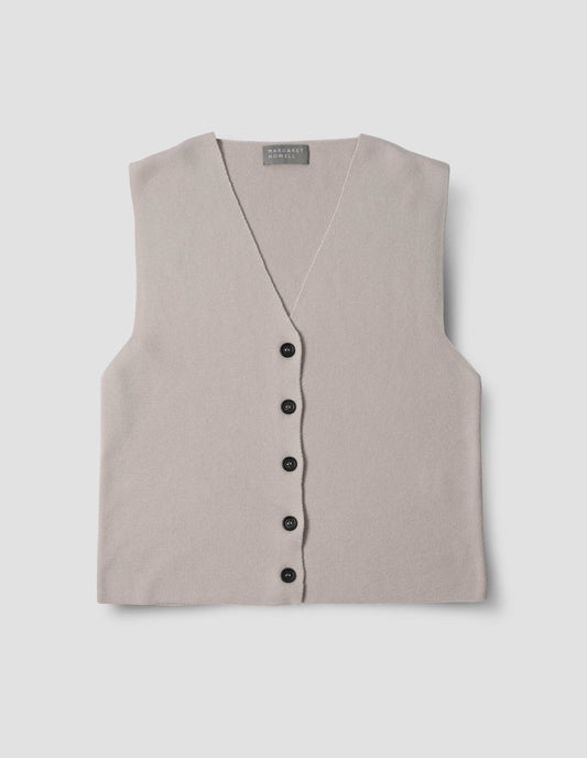Light grey knitted waistcoat with black horn buttons, front flat lay view.