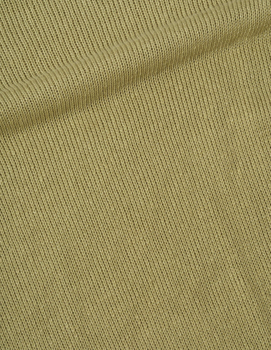 Green jumper linen cotton fabric swatch.