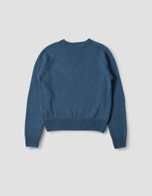 Blue crew neck jumper with raglan sleeves, back flat lay view.