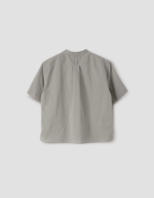 Grey collarless short sleeve shirt with box pleat on back yoke, back view