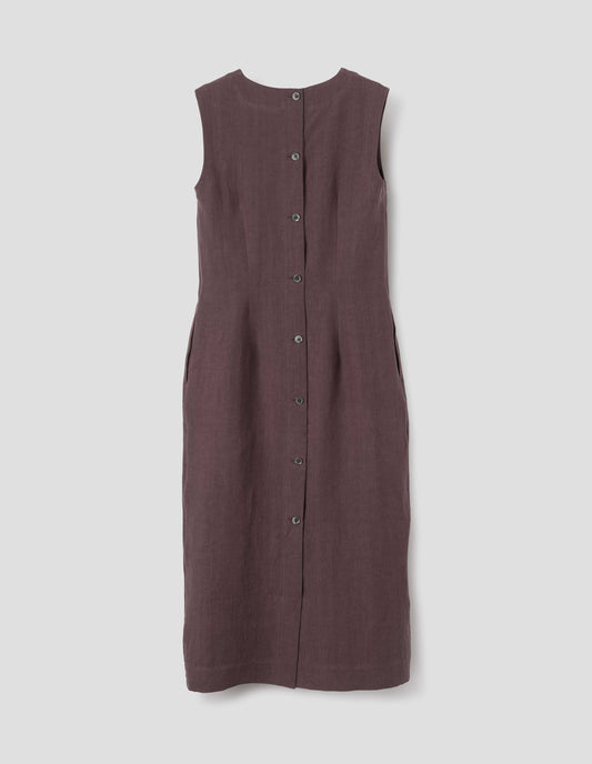 Brown midi-length sleeveless dress with concealed side pockets, mother of pearl buttons and back vent. Back flat lay view.