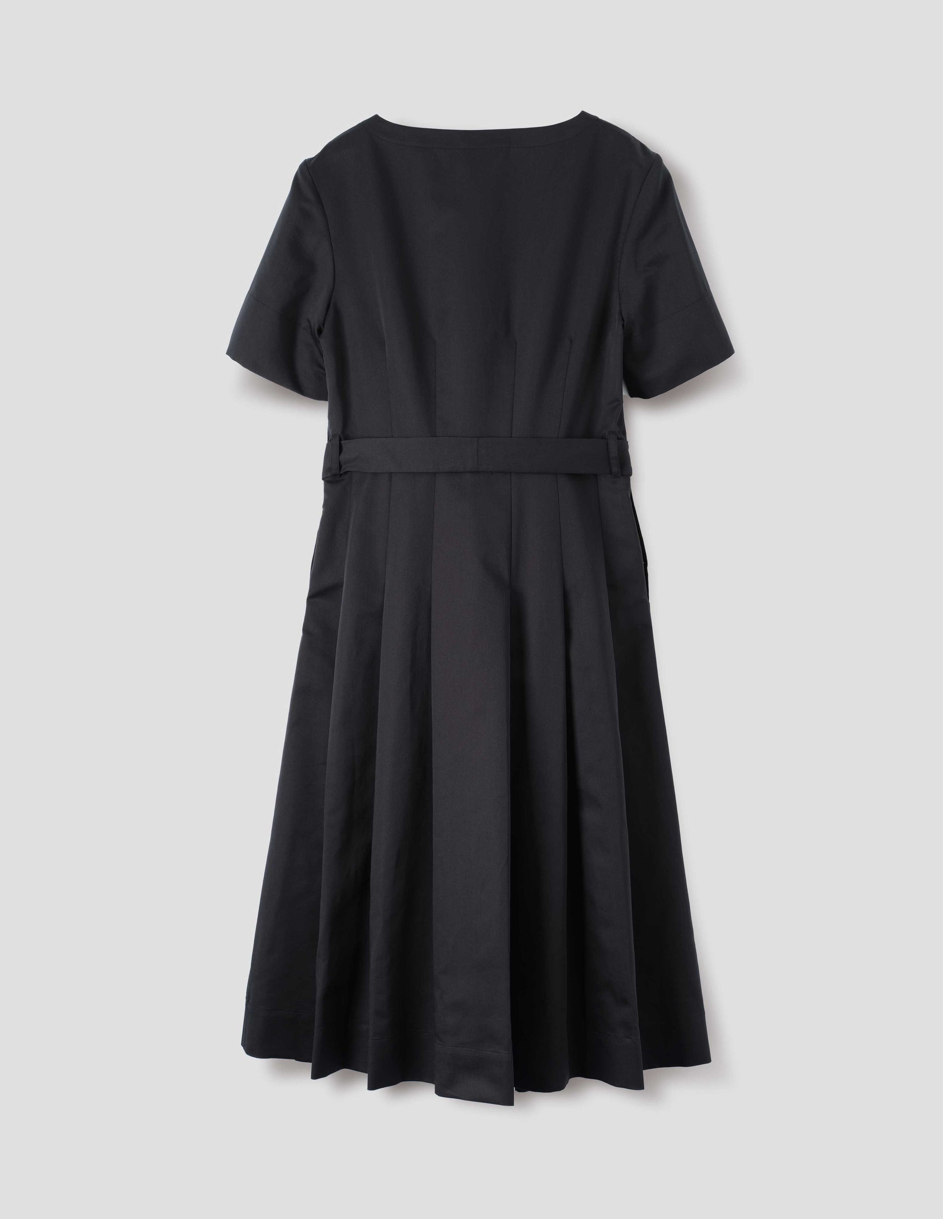 Black short sleeve a-line cotton silk satin dress, with fitted waist, pleated skirt, belt loops and detachable matching belt. Back flat lay view. 