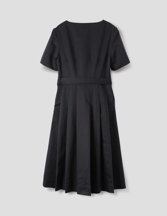 Black short sleeve a-line cotton silk satin dress, with fitted waist, pleated skirt, belt loops and detachable matching belt. Back flat lay view. 