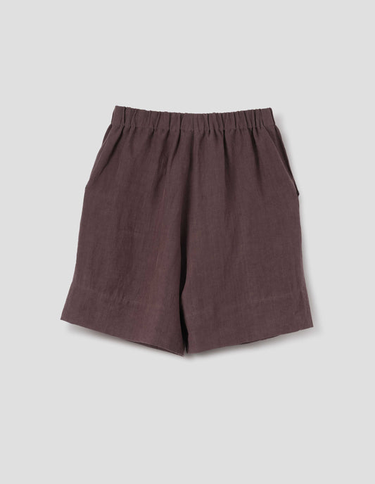 Reddish brown linen shorts, with elasticated waistband, side entry pockets and deep hem. Back flat lay view.