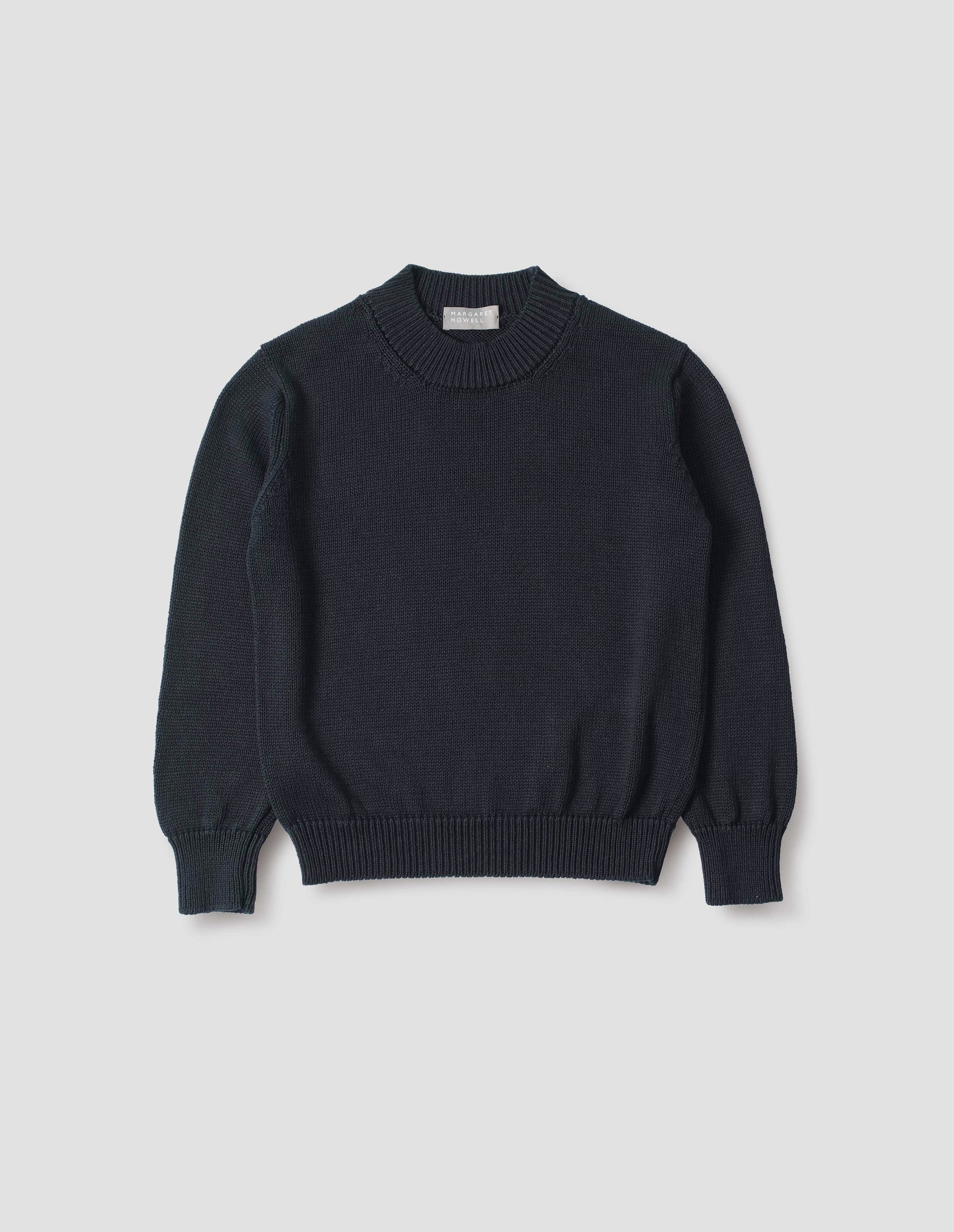 Dark navy blue linen and cotton crew neck jumper, with deep rib crew neck, rib cuffs and hem. Front flat lay view.