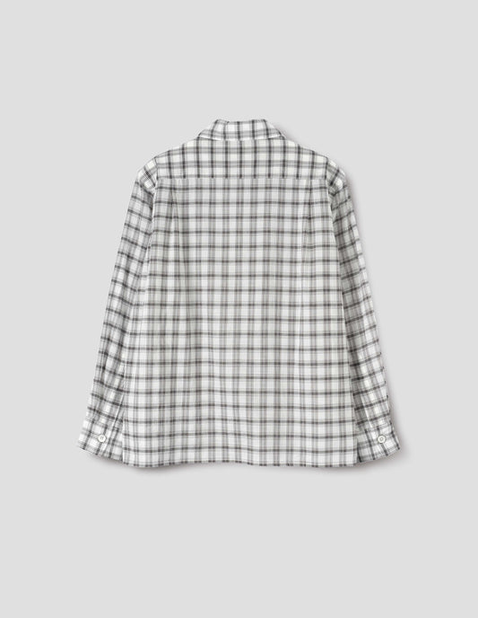 White with black check shirt with pleats on the back yoke. Back flat lay view.