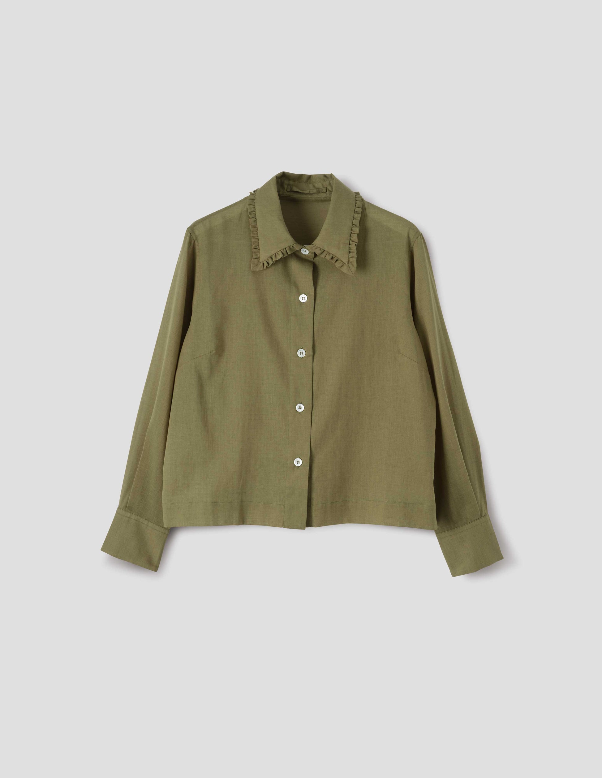 Green cotton cashmere frilled collar long sleeve shirt, with mother of pearl button closure. Front flat lay view. 