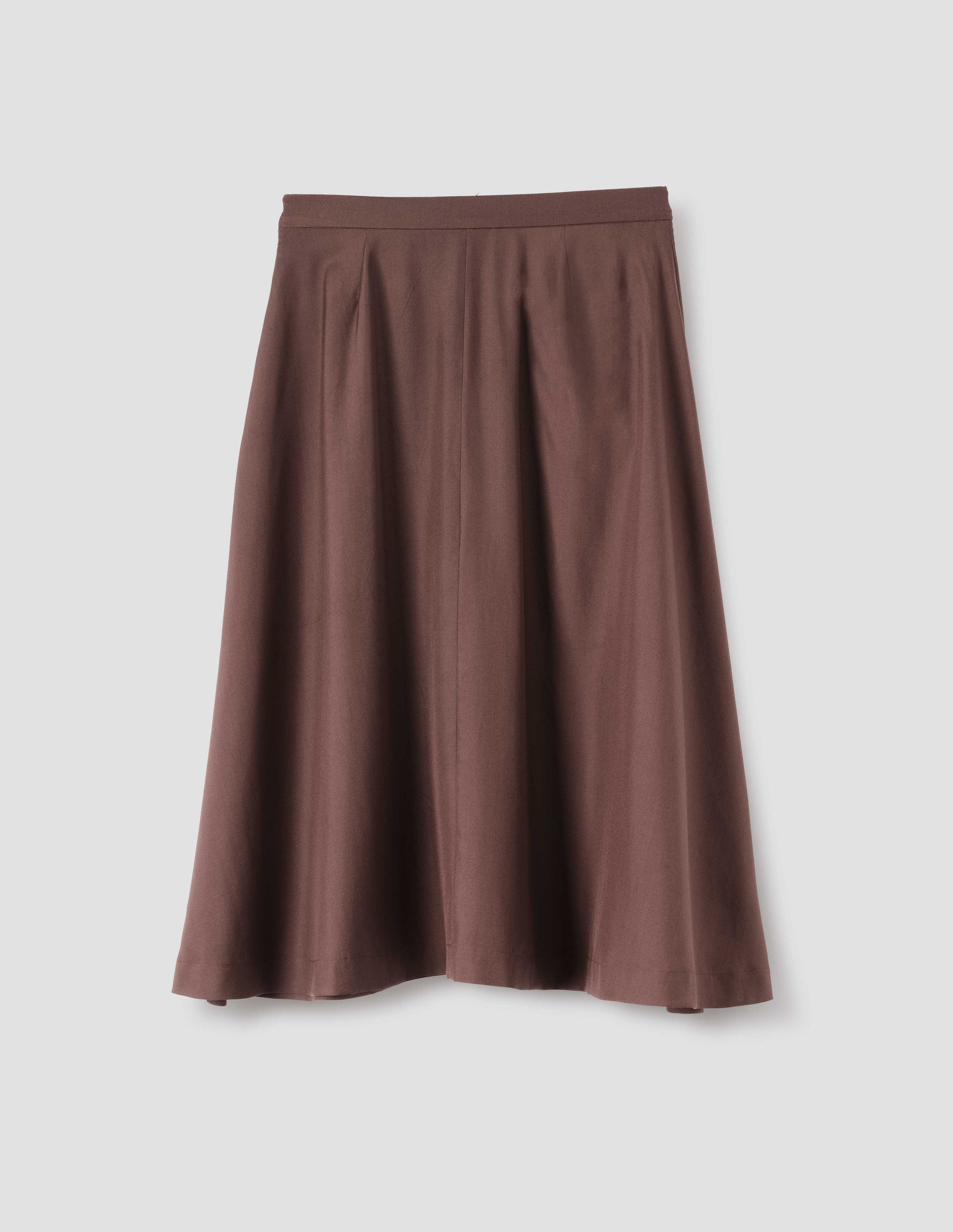 Brown matt silk skirt, with seam detailing running down centre of skirt. Back flat lay view. 